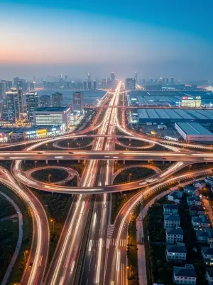 Modern highway interchange at dusk, symbolizing robust infrastructure investment and progress.